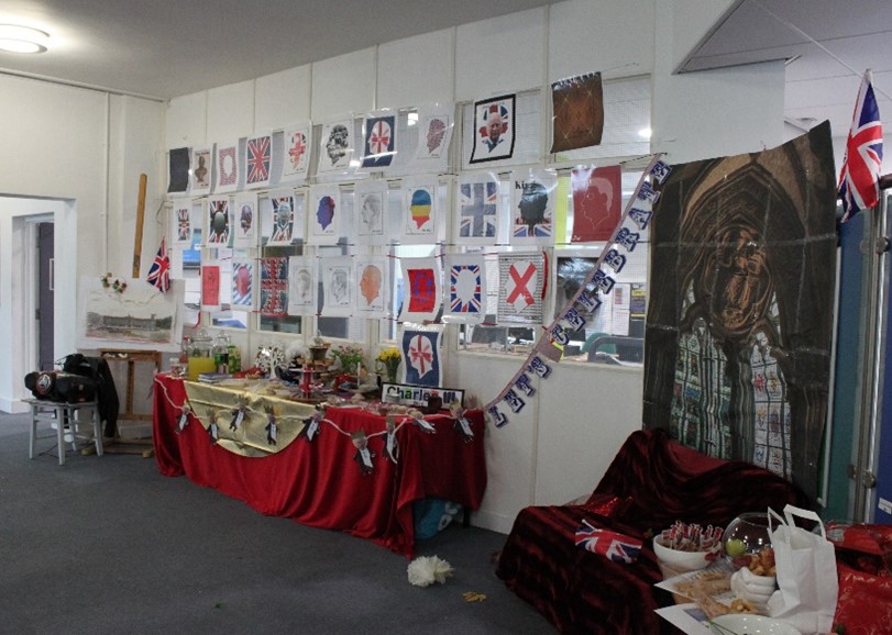 Display of coronation stamps on walls and artwork
