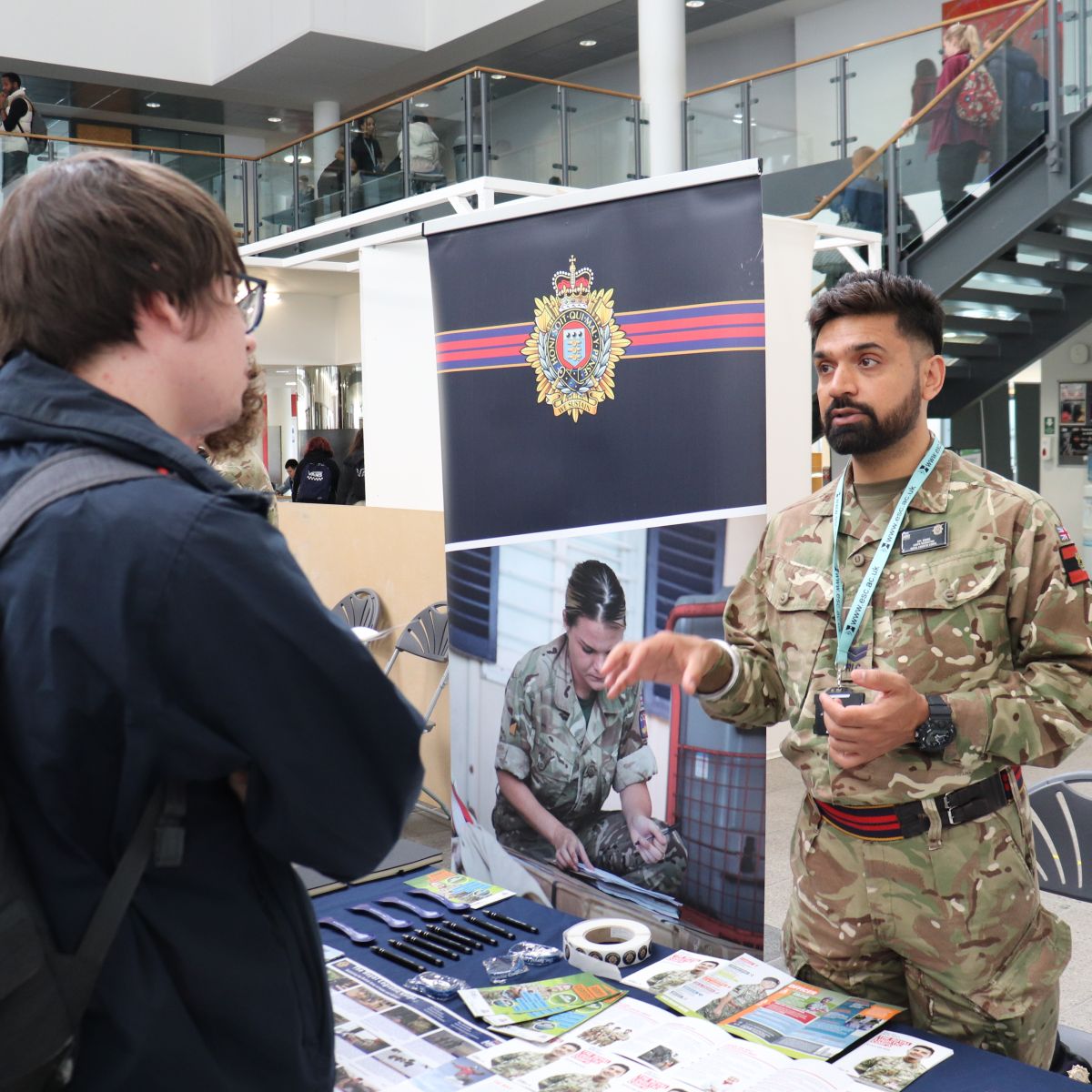 East Surrey College student speaking with an Army Engineer 