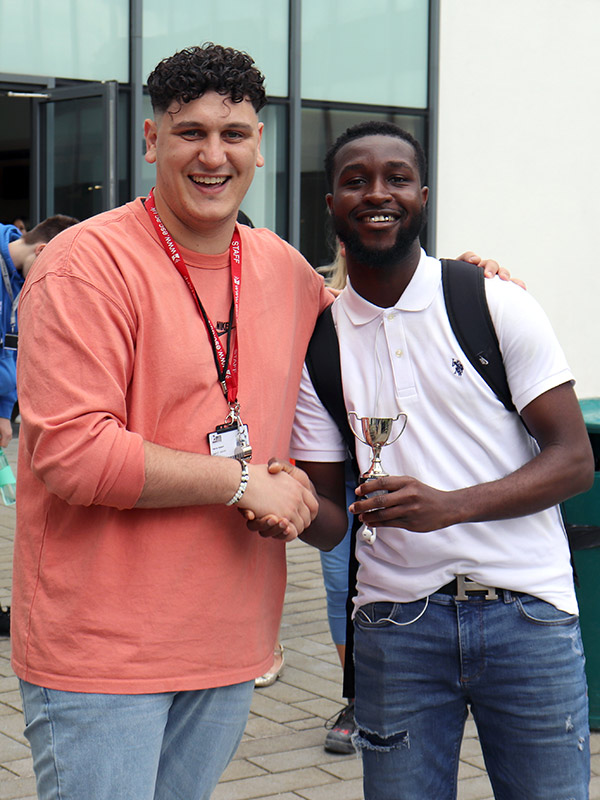 East Surrey College student Gideon receiving his Enrichment Student of the Year award