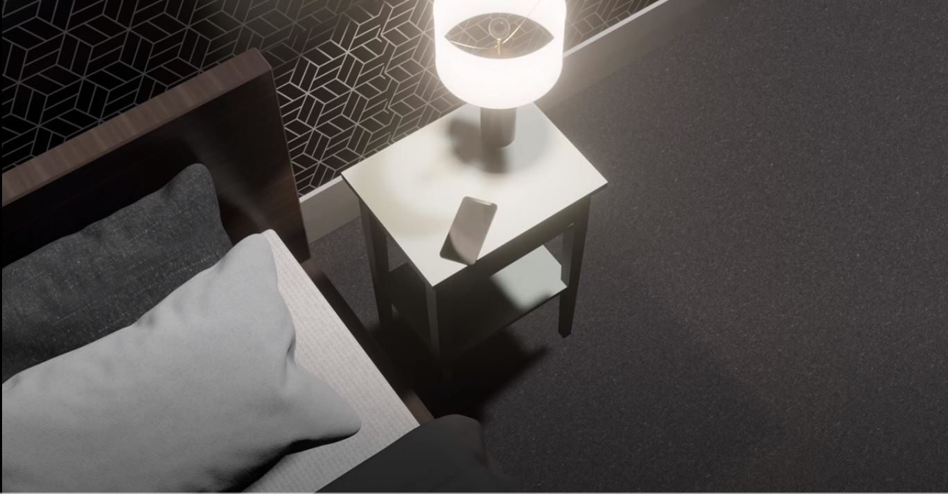 Image from Luca's film showing alarm clock on table by bed to show start of the day