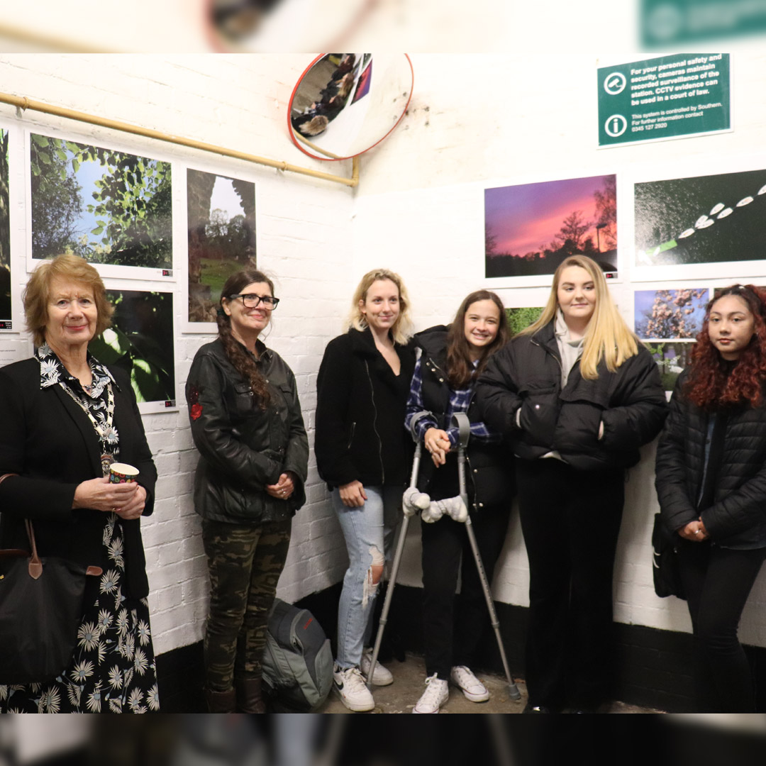 Reigate School of Art students attend an event at Reigate Station. 