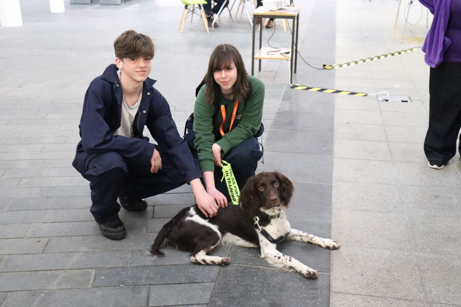 Two students with a Police Puppy trainee