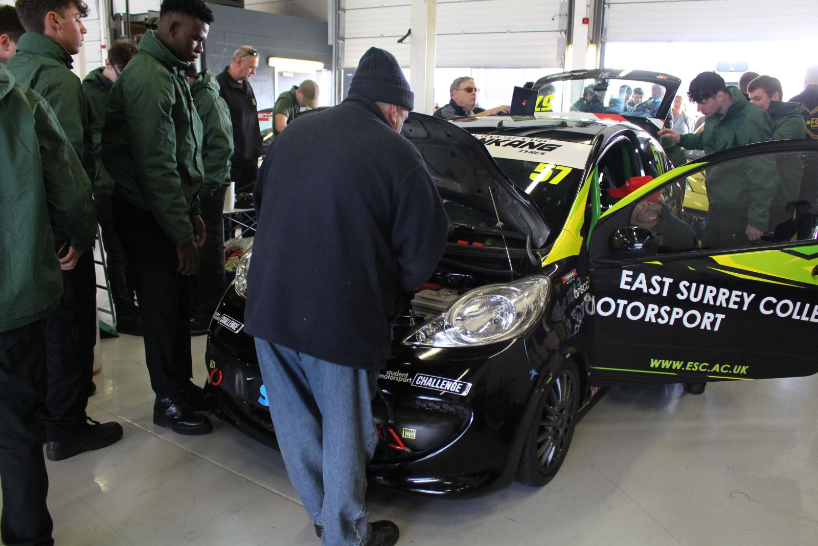 Motorsport students and staff working on the car before round 17