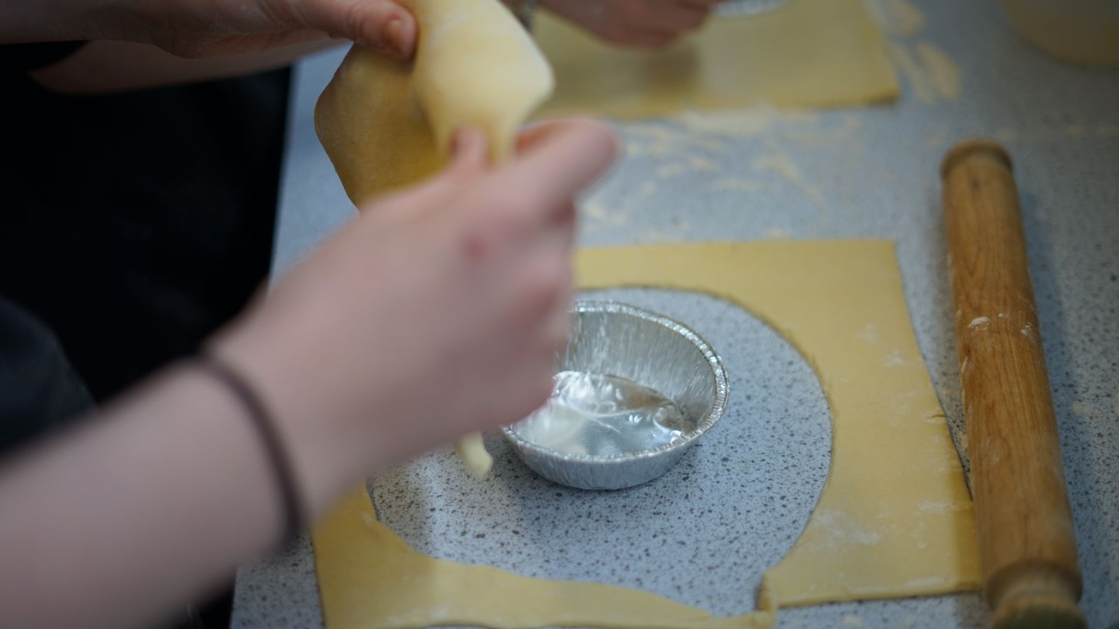 Student cutting the pastry