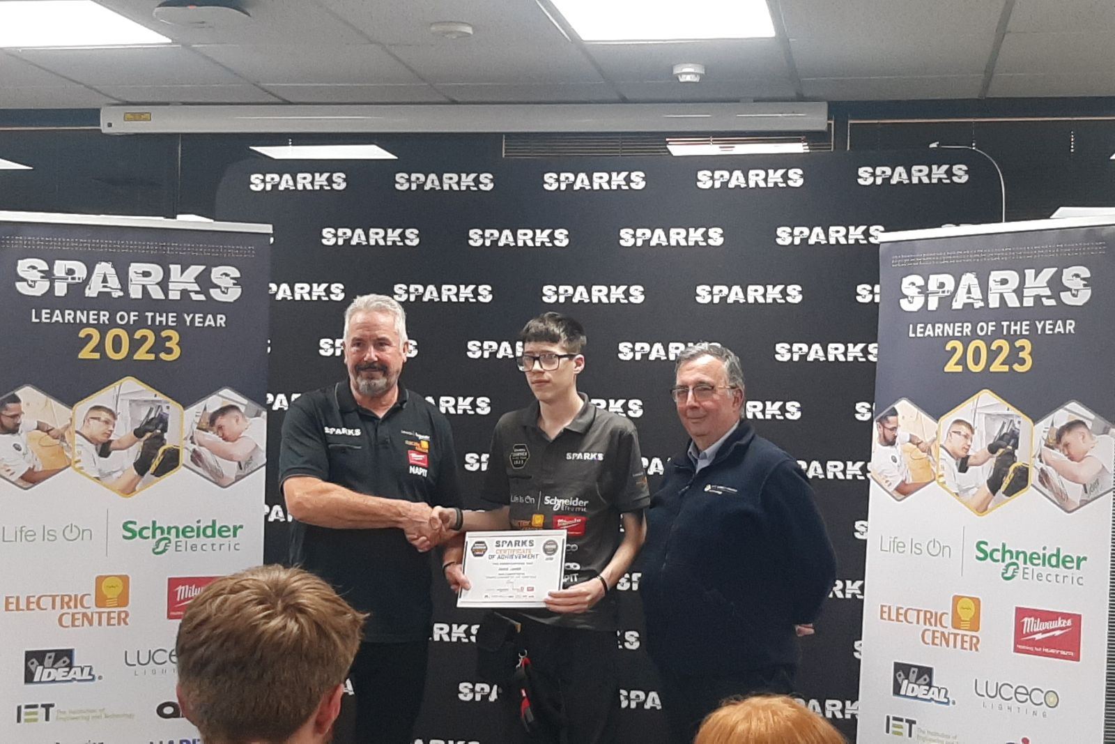 Electrical Installation Apprentice, Reece collecting his certificate